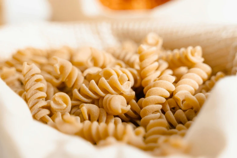 a pile of cooked pasta sitting on top of a table