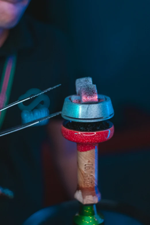 a piece of metal being worked on by an engineer