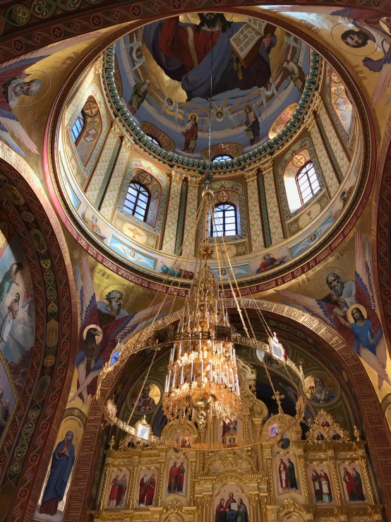 an interior view of a church that is decorated with golden colors and decorations