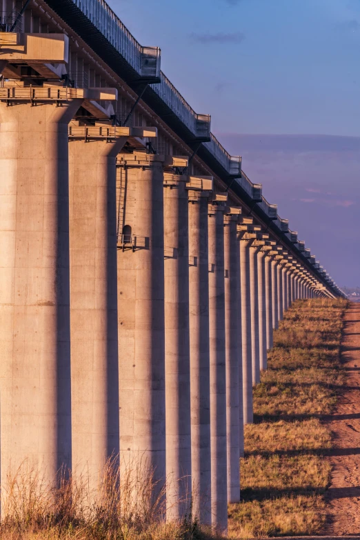 a long row of concrete pipes, one under the other