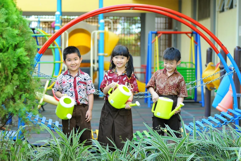 three s in green watering suits are posing for the camera