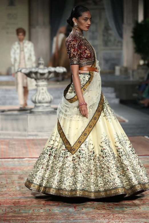 an indian bride in a lehenga with a veil