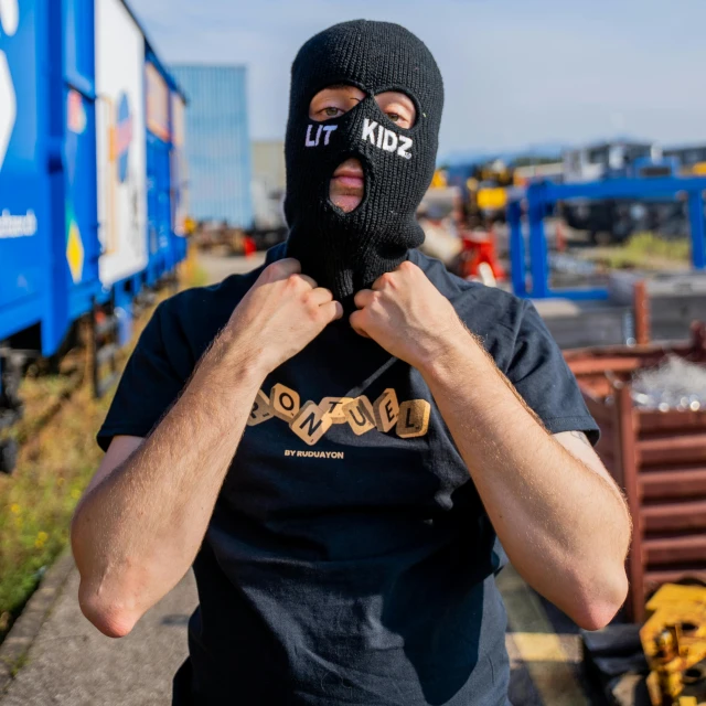 a man wearing a ski mask covering his mouth