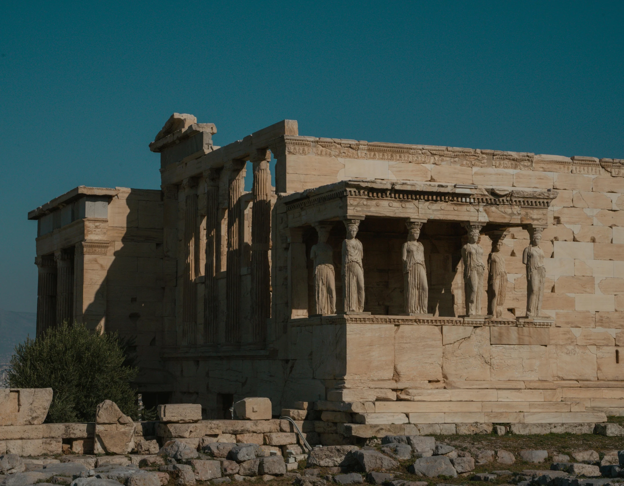 ancient ruins are covered by a very bright blue sky