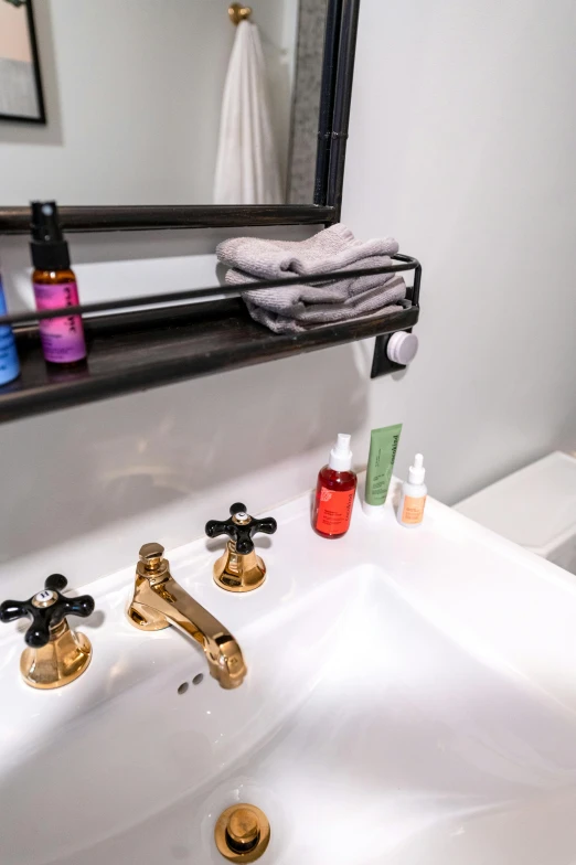 the sink is covered with three items that can be used in a wash basin