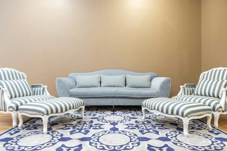 a white and blue room with chairs and a couch