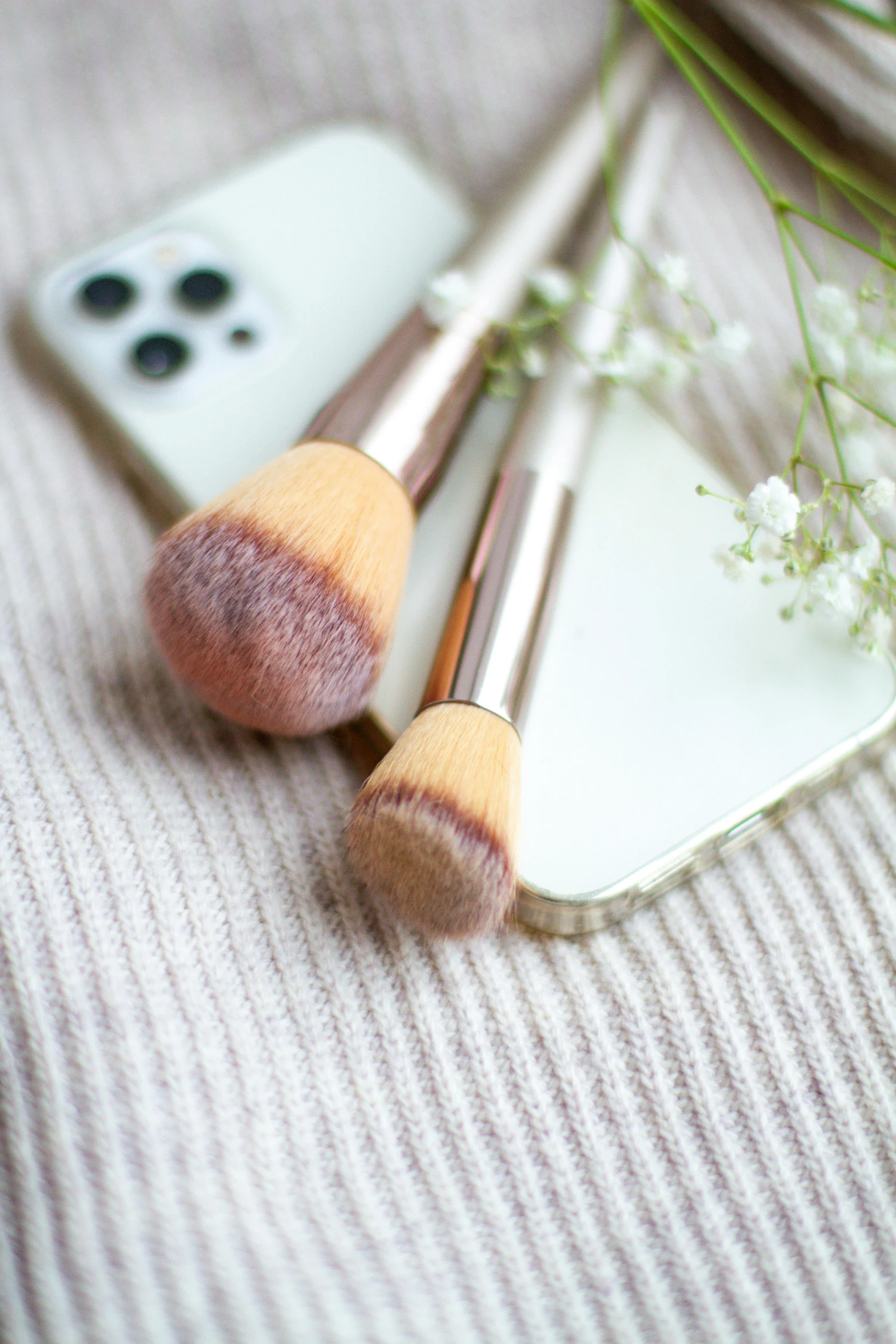 two pink brushes sitting on top of each other