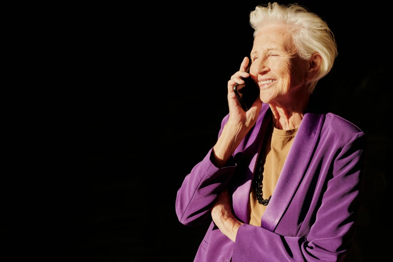 an older woman talking on a cell phone