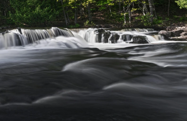 an image of a waterfall with water flowing