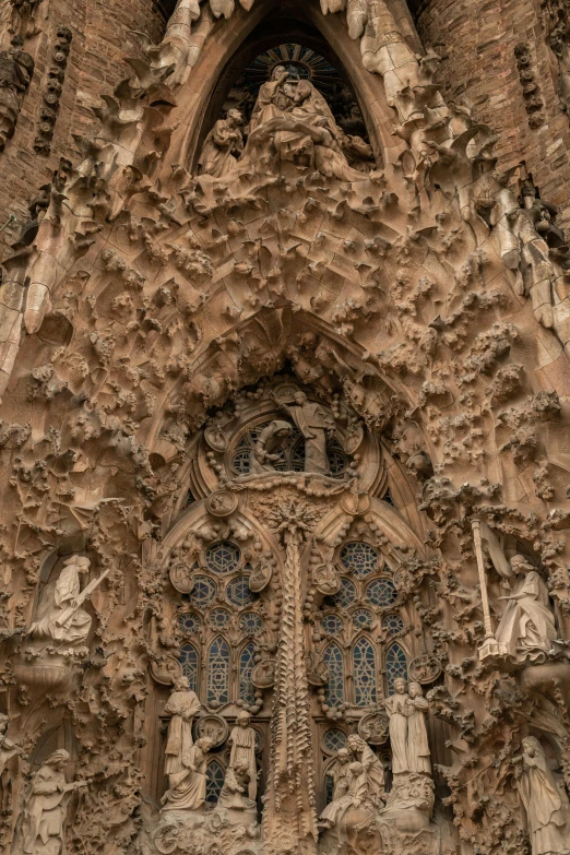 a very ornate facade with carved stones and people