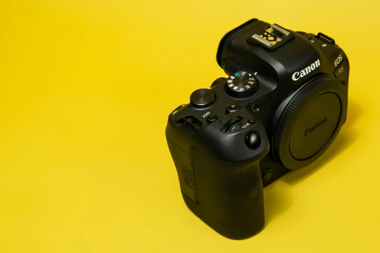 a camera that has a yellow and black background