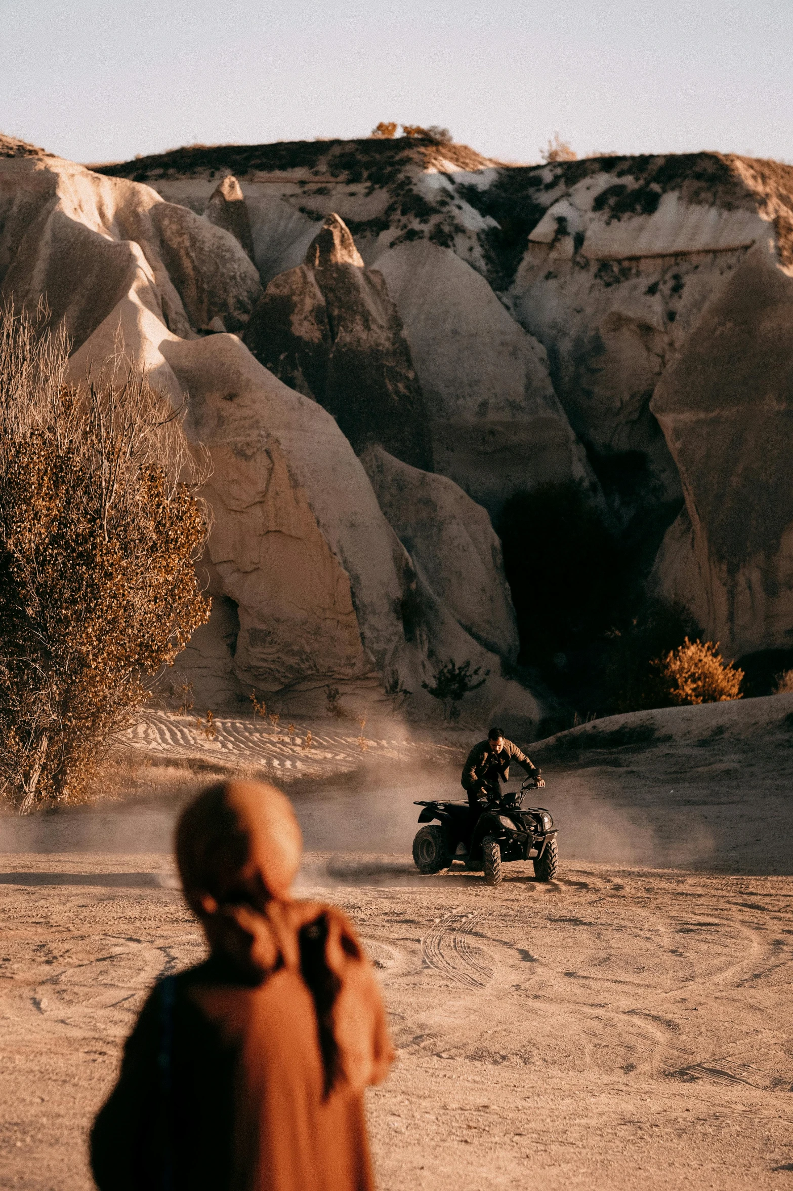 there is a motor cycle that is sitting out in the desert