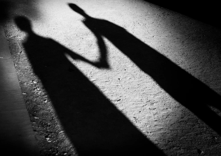 a man casting a shadow with his hand