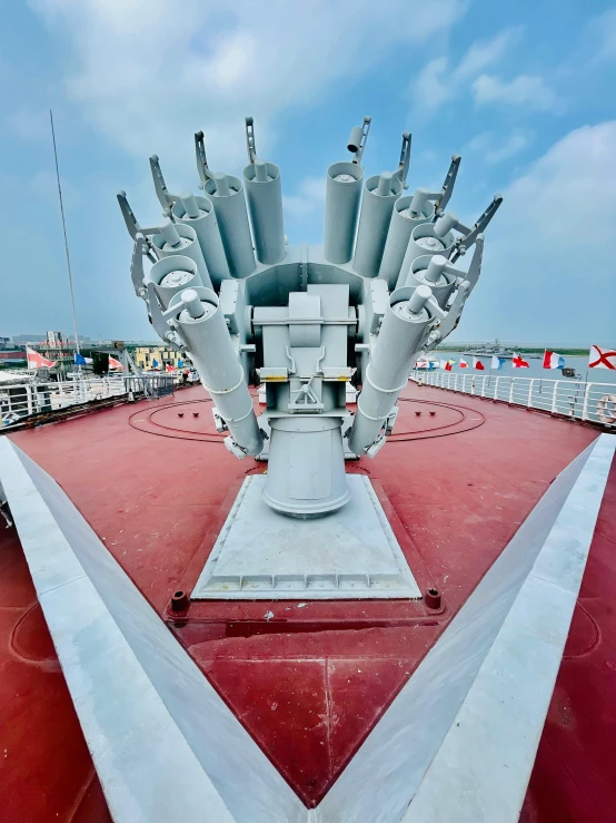 an air craft that is on the side of a large ship