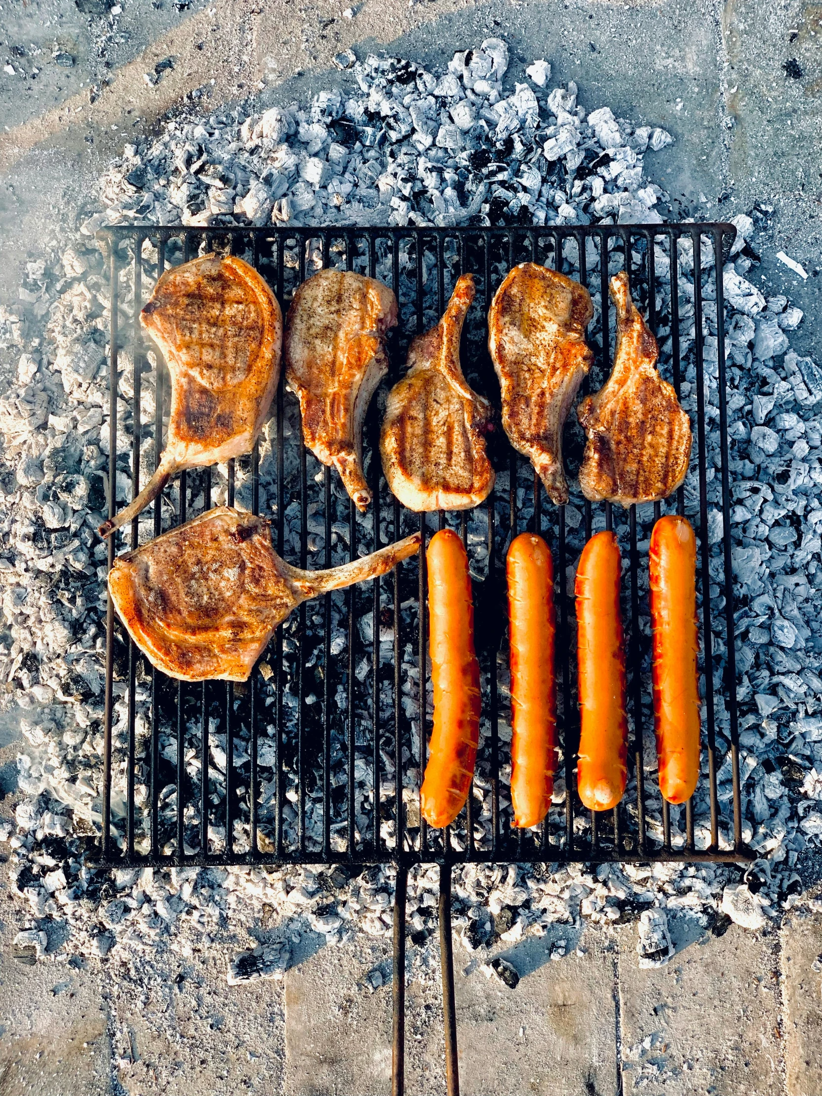 a metal grill that has food on it