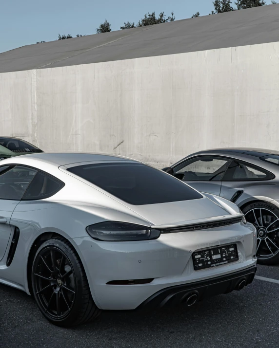 some cars in a parking lot near one another