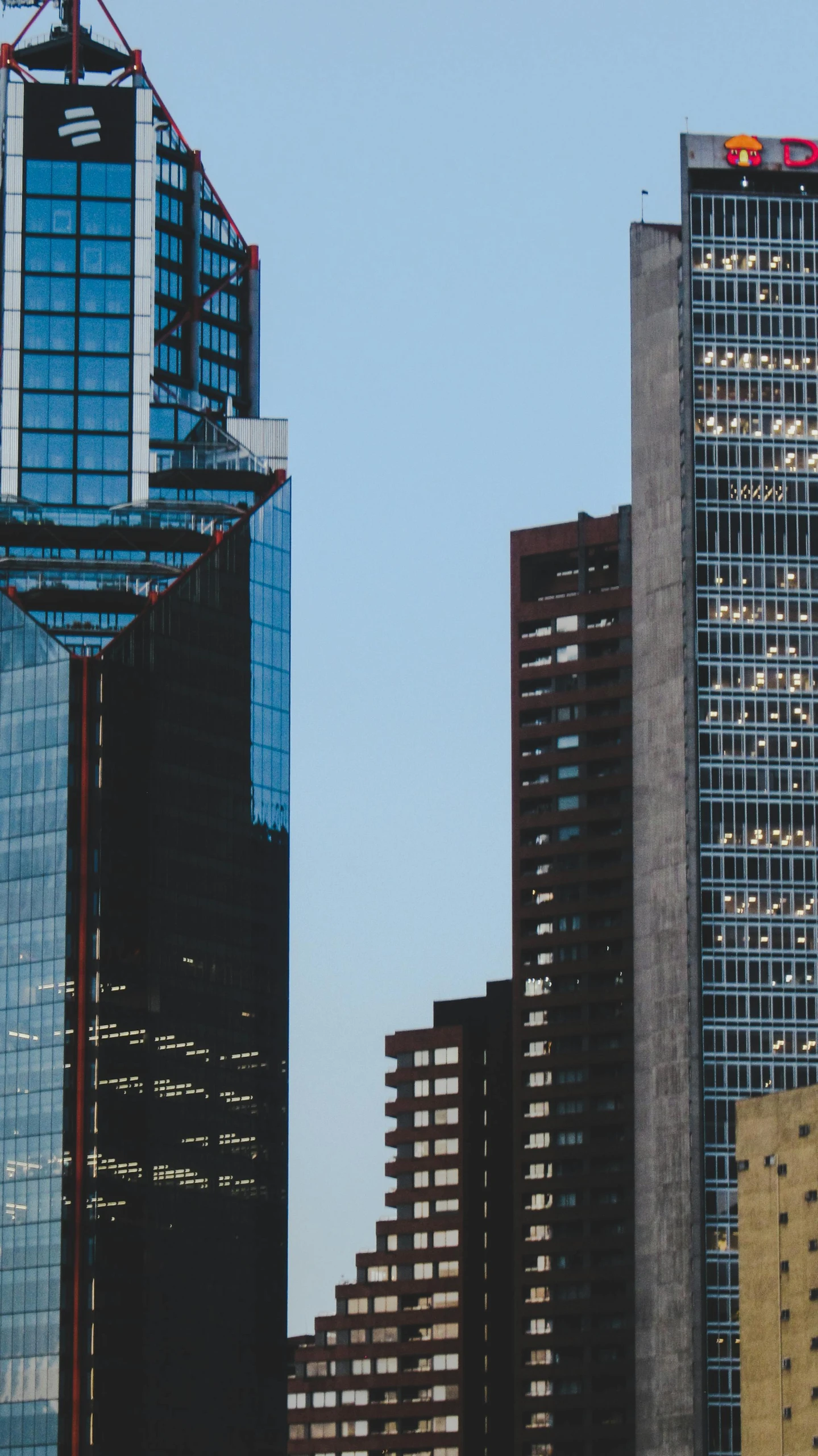 the tall buildings are surrounded by windows