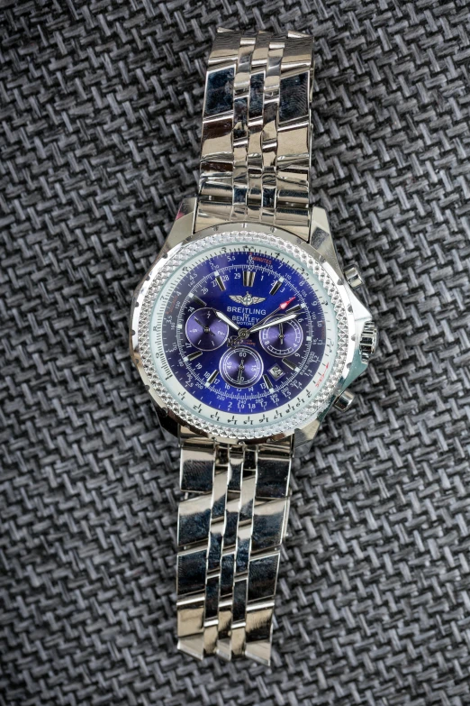 a close up of a watch on a table