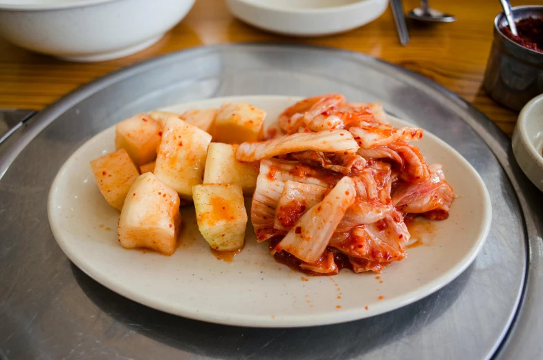 a plate that has food on it next to a bowl