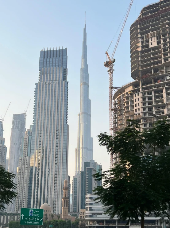 tall buildings in the distance and some signs