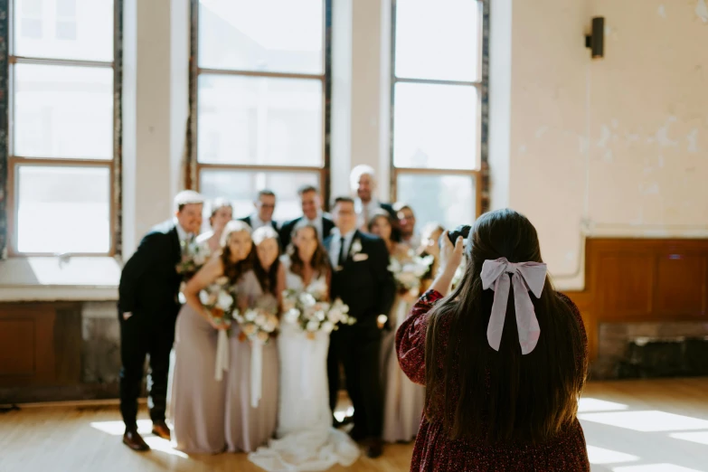 there are many people taking pictures together at this wedding