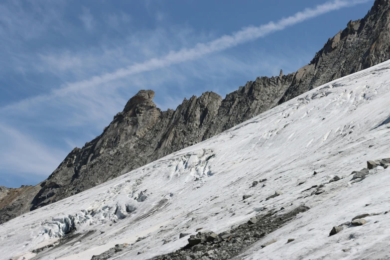 a large snow hill with snow on top