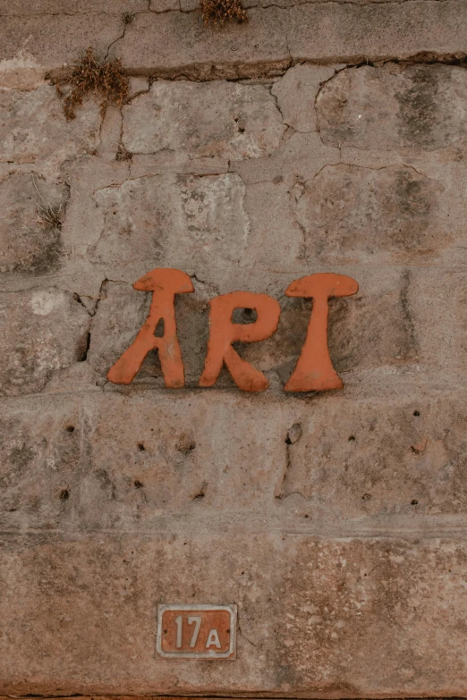 the word art written in orange with large letters