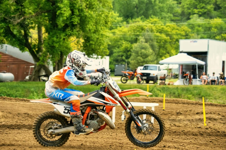 a man riding on the back of a dirt bike