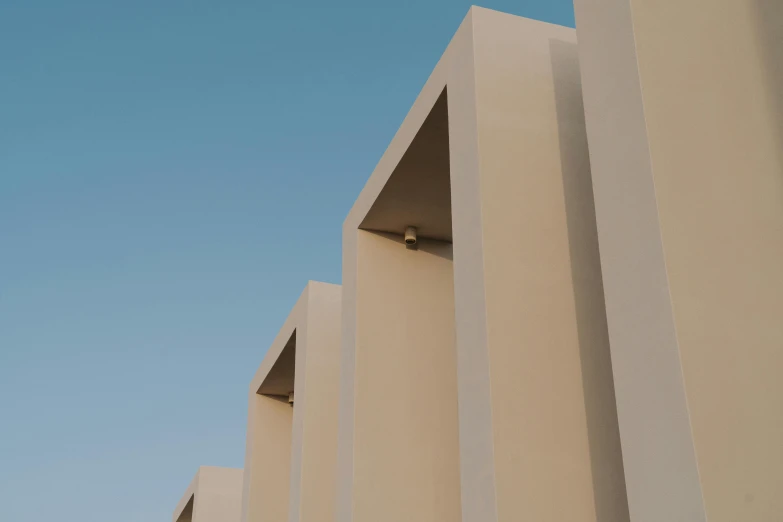 a white building next to another building on the side