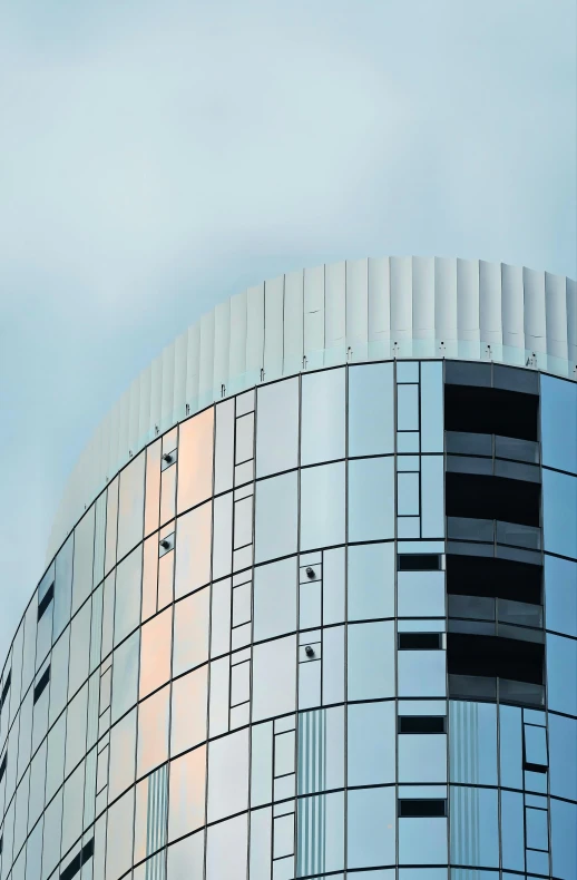 a building with square designs is shown against a blue sky