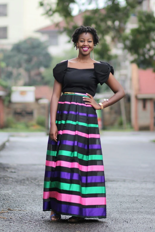 a woman stands in the middle of the road