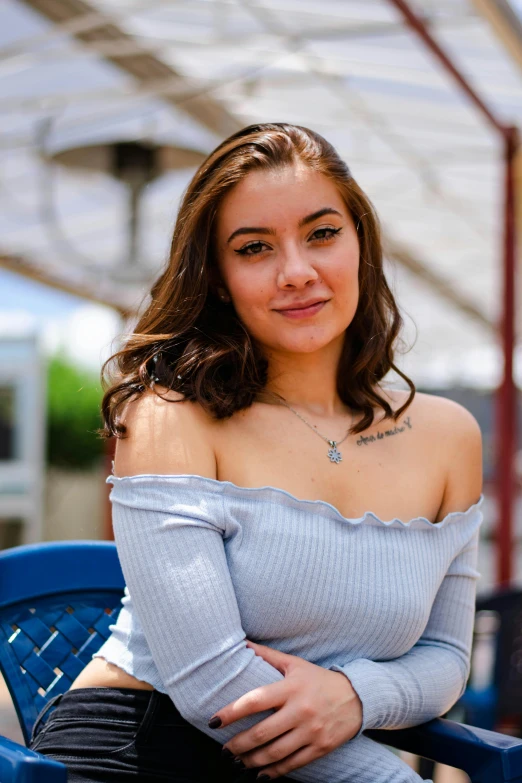 a women who is sitting down on a chair