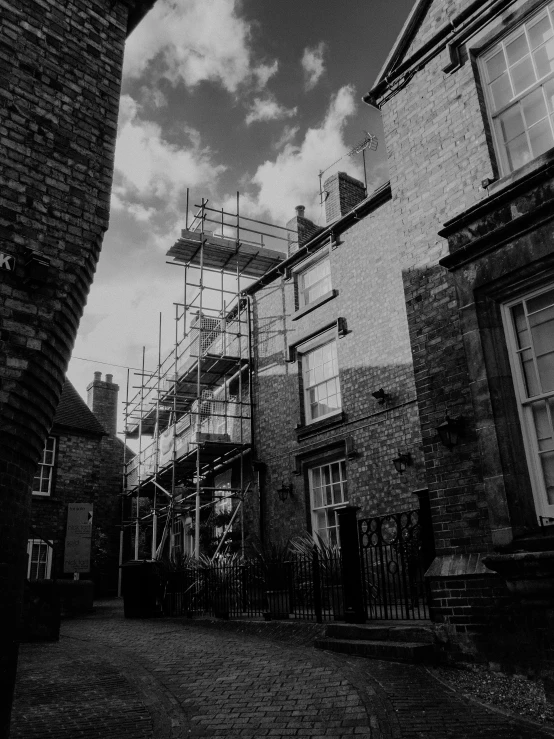 a house under construction with scaffolding surrounding it