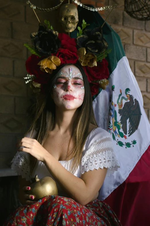 a woman dressed in mexican makeup and flowers