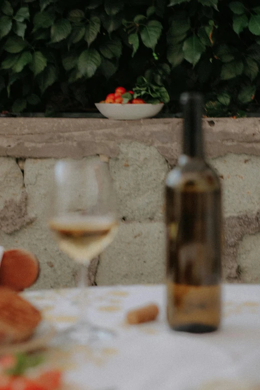 a wine bottle sitting next to a glass of wine