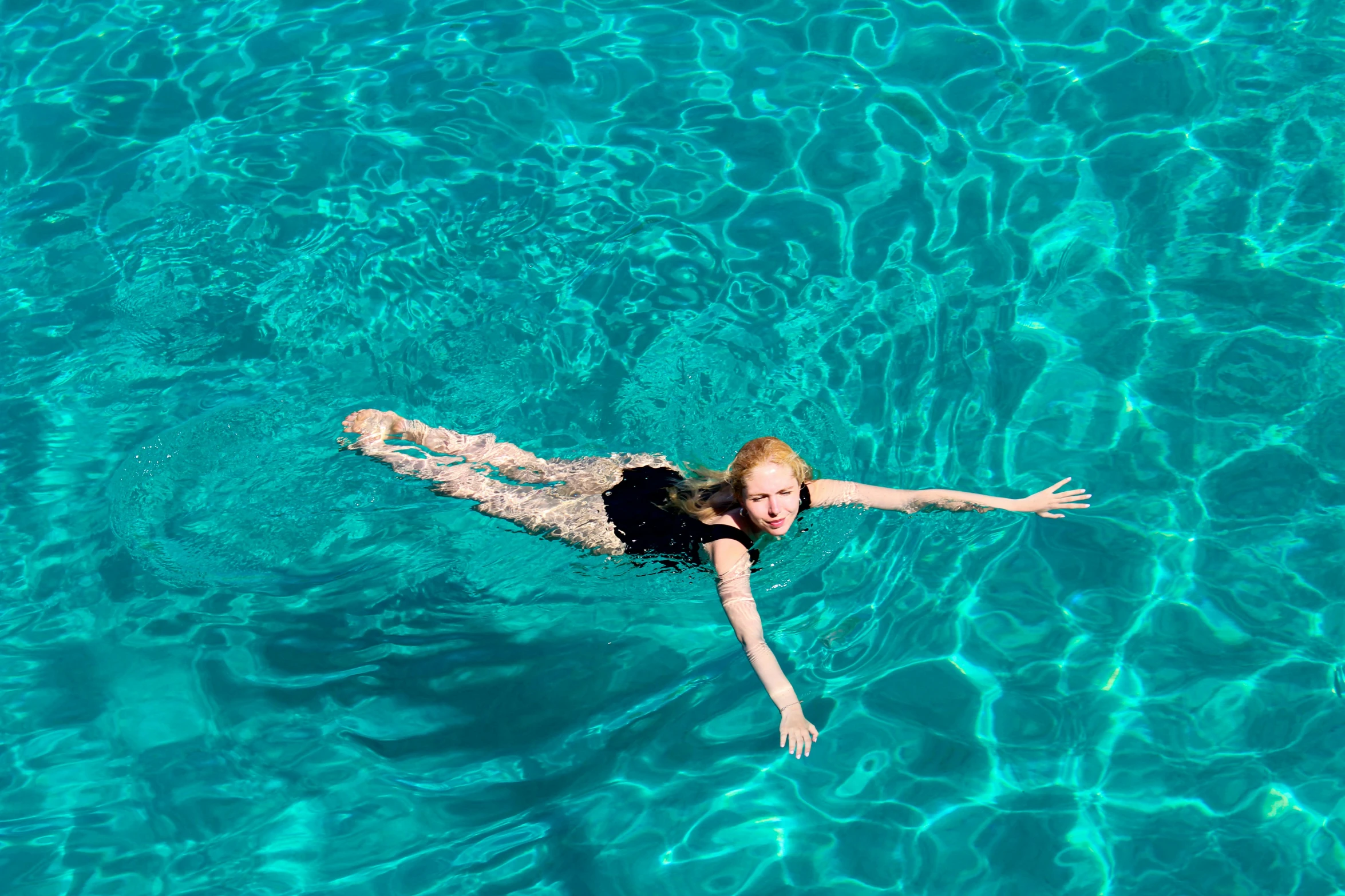 a woman in the water swimming