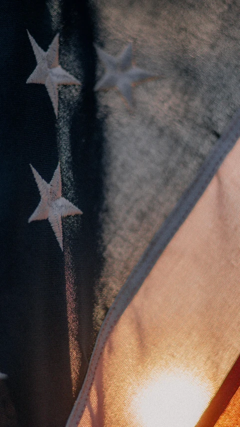 the american flag as seen from the ground