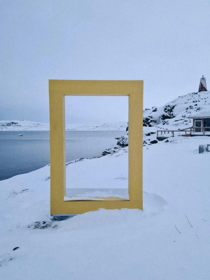 a picture frame is standing in the snow