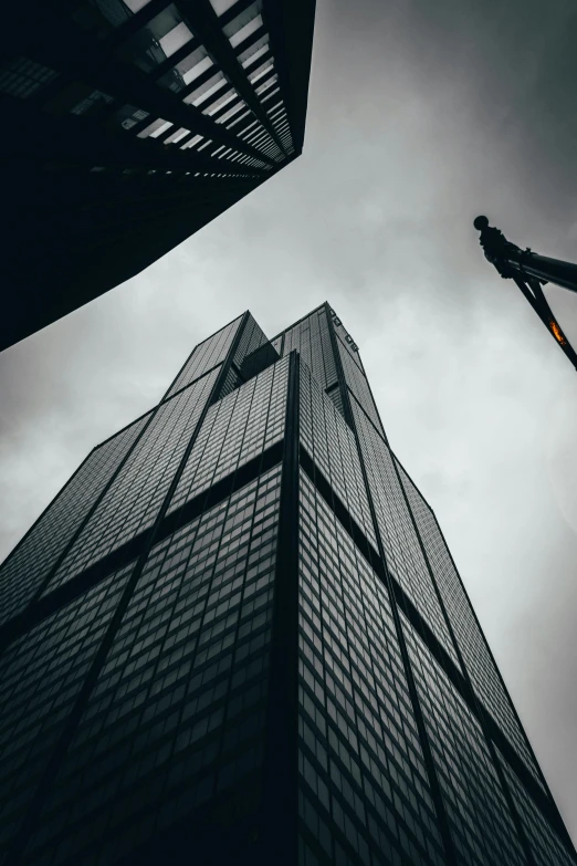 looking up at two tall buildings from ground level