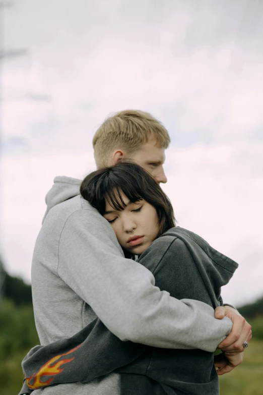 an image of a couple holding each other