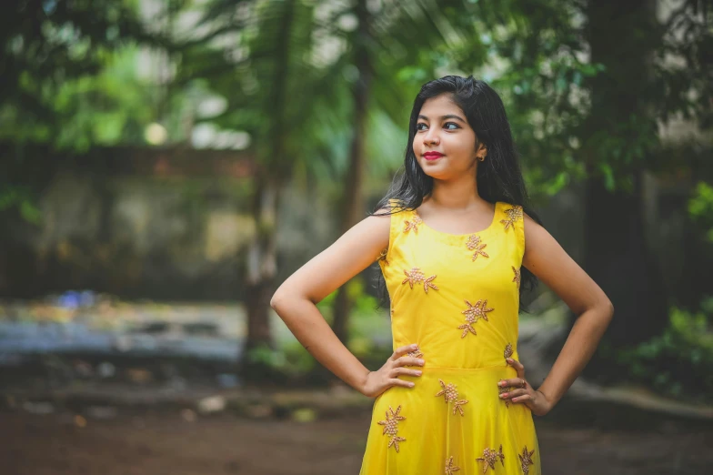 a woman standing and posing for a portrait