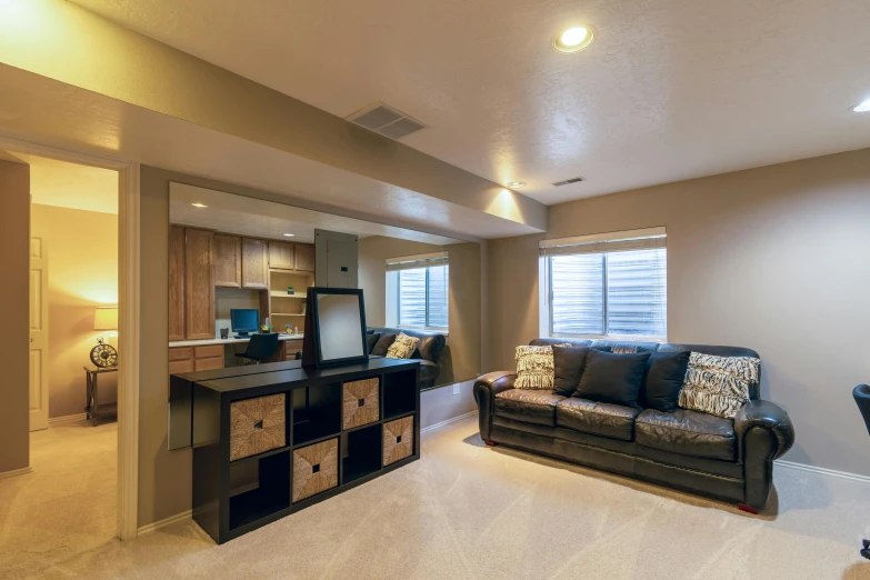 the interior of a modern apartment living room with large windows