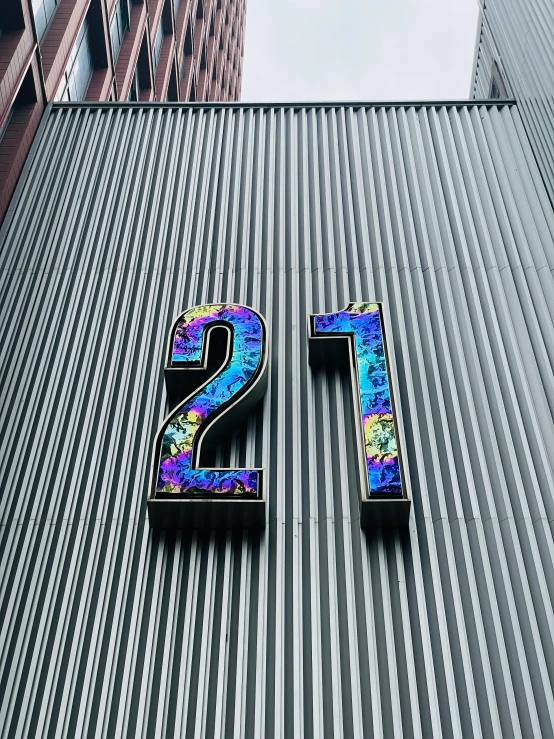 two numbers sitting on the side of a building with buildings