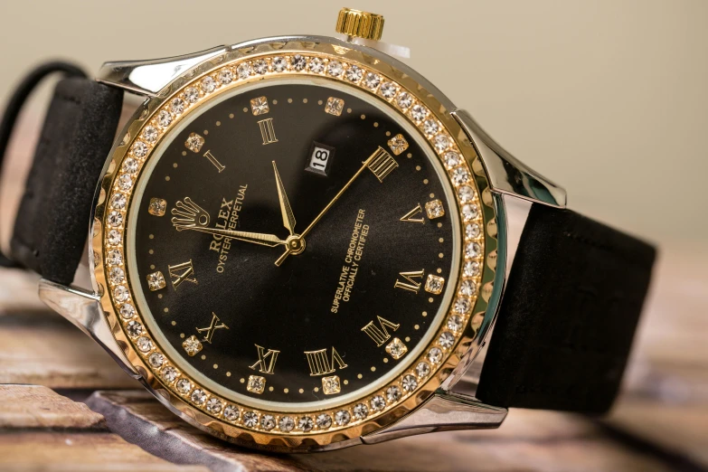 a gold watch is surrounded by diamonds