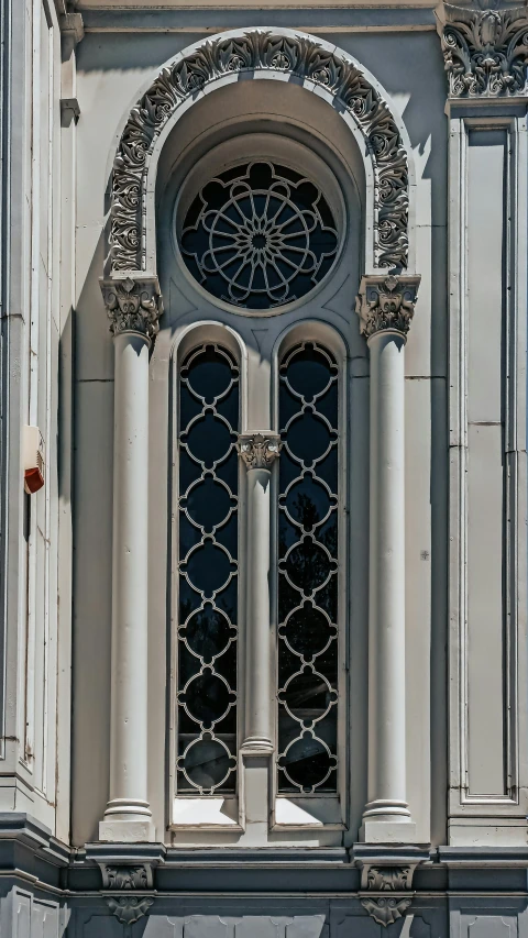 a gothic - inspired building in charleston, with large windows and decorative columns