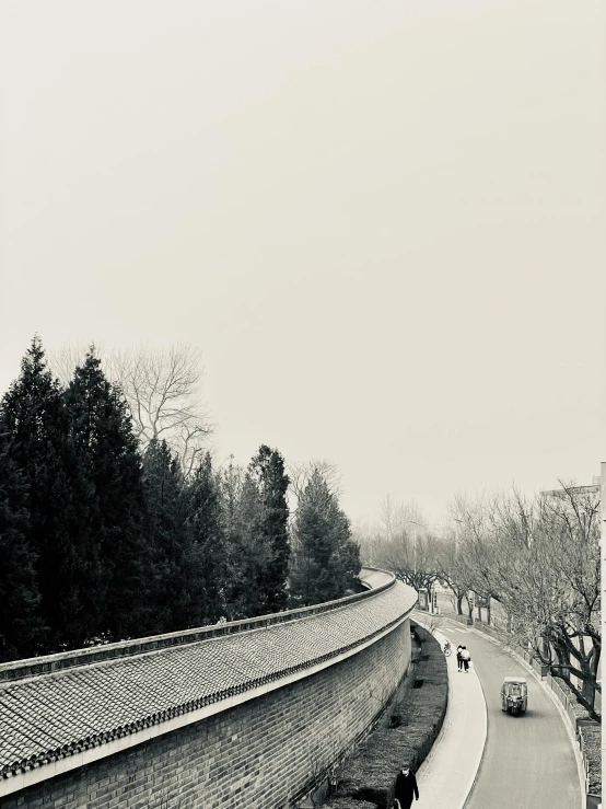 a couple is crossing the bridge that goes to another side