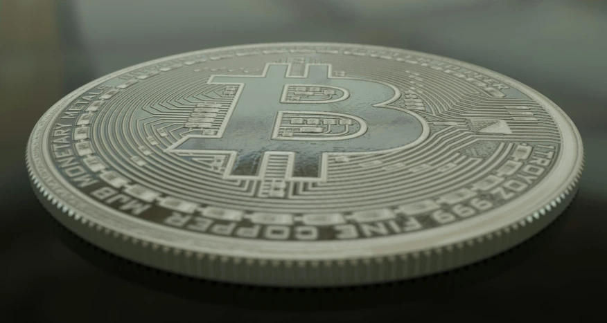 a bitcoin with the words bitcoin in silver ink