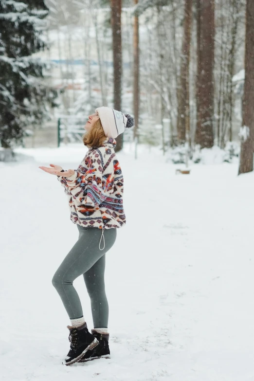 a woman standing on her hind legs in the snow