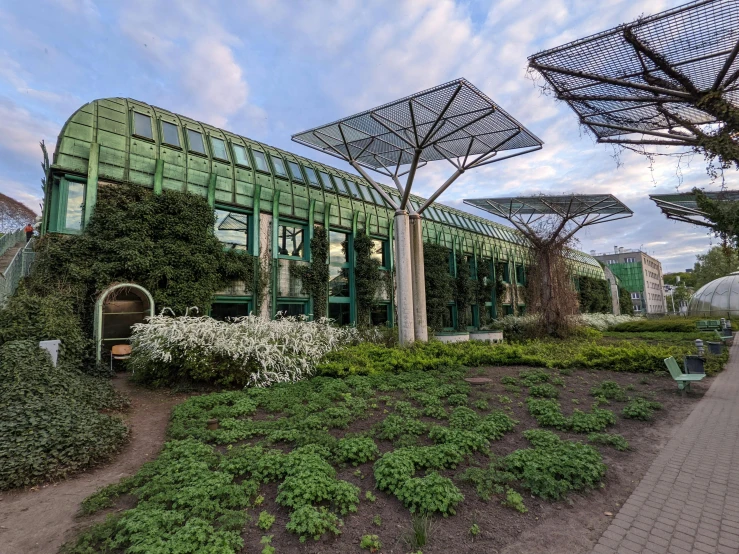 the green house has many plants in it