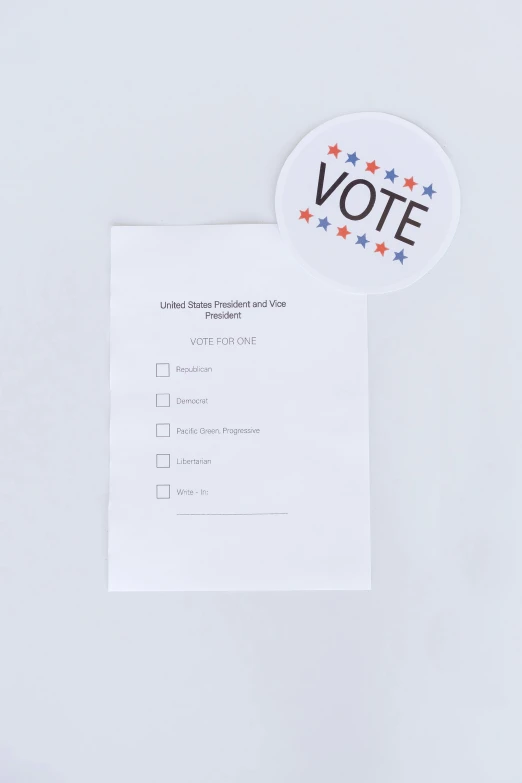 vote sticker is shown on a sheet of paper